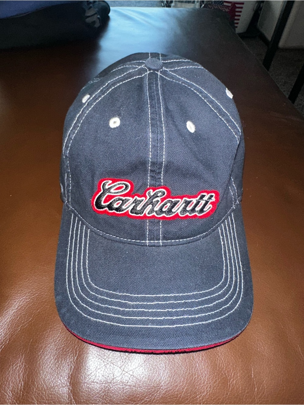 Carhartt Navy Cap with Orange Logo and White Stitching